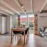 Living area with dining table, sofa, and view of terrace