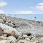 Rocky beach with steps and view of the sea
