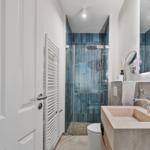 Bathroom with shower, sink, and toilet