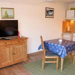 Essbereich / Küche mit Sideboard und TV