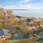 House with garden and view of a lake.