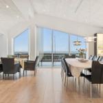 Dining room with large window view of the landscape