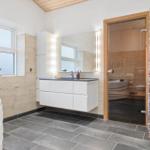 Bath with shower, bathtub, and sink with mirror.