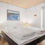 Bedroom with double bed, two bedside tables, and window to terrace.