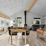 Dining area with table and chairs, living area with sofa and fireplace, large windows overlooking terrace.