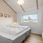 Bedroom with bed, window, and closet