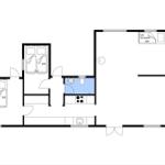 Apartment with two bedrooms, kitchen, and living area with sleeper sofa.