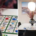 Tisch mit Spiel und Chips, Wandbild und Lampe im Raum