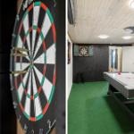 Dartboard and air hockey table in game room with green carpet and wooden ceiling.