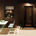 Terrace with table, chairs, and seating. Wooden wall and plants visible.