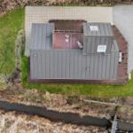 Modern cabin with terrace, garden, and riverfront location.