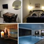 Zimmer mit TV, Tisch, Bett und Sauna. Außerdem eine beleuchtete Schwimmhalle.