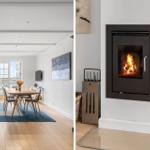 Dining area with table and chairs. Fireplace with burning wood.