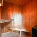 Sauna with wooden walls and benches.