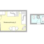 Ferienwohnung 2 mit Küche, Schlafbereich und Bad. Raumplan zeigt Möbel und Sanitäreinrichtungen.