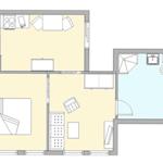 Dieses Apartment hat eine Küche, ein Wohnzimmer, ein Schlafzimmer und ein Badezimmer.