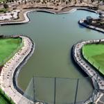 Aerial view of a mini golf course with a large water feature.