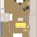 Ein Raum mit Schlafzimmer, Wohnbereich, Essplatz und Bad. Möbel und Einrichtung sind sichtbar.