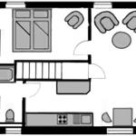 Dieses Apartment hat eine Küche, ein Bad, einen Wohnbereich und eine Treppe.