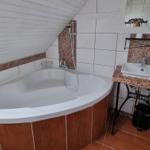 Bath with shower and sink on stand