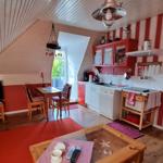 Kitchen with dining area and living room under roof