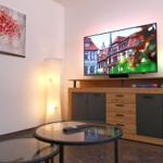 Living room with pleasant lighting and smart TV