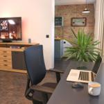 Television and excellent workspace in the living room of the holiday flat