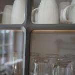 Glass and cup cabinet in kitchen area with good lighting