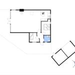 Dieses Apartment hat eine Küche, ein Bad und einen Wohnbereich mit Schlafplatz.