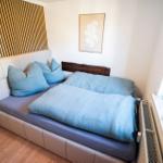 Schlafzimmer 3 der Ferienwohnung Bergmoment in Blankenburg Harz mit 140 cm Bett.