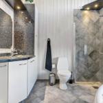 Bathroom with shower, toilet, sink, and whirlpool