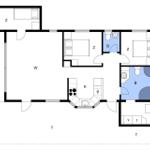 Apartment with kitchen, two bedrooms, bathroom, and living area with window.