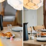 Esstisch mit Croissants, Gläsern und einer schwarzen Kanne unter einer Lampe.