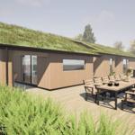 Modern villa with grass roof and large terrace with dining set.