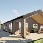 Modern villa with wooden cladding and grass roof. Deck with seating and plants.