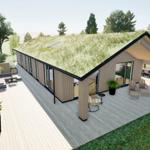 Modern villa with green roof, large wooden deck, and garden furniture.