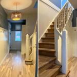 Hallway with wooden staircase and pendant light. Paneling and door visible.