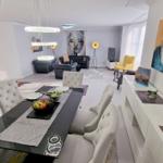 Esszimmer mit Esstisch und Stühlen. Wohnzimmer mit Sofa, Sessel und Wandbild.