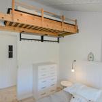 Upper loft bed and lower mattress. Dresser and bedside table.