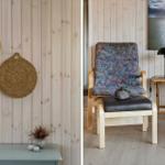 Holzwand mit geflochtenen Hängern, Sessel mit Muster, Beistelltisch und Wandbild