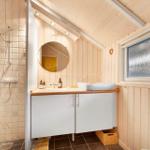 Bath with shower, sink and window