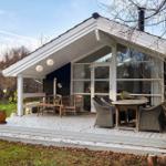 House with terrace, garden, and seating areas.
