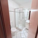 Bathroom with shower, toilet, and sink