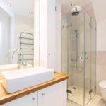 Bathroom with shower, sink, and toilet