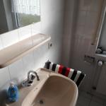 Bathroom with sink, mirror and window