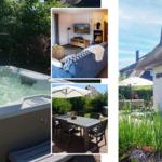 Haus mit Dachstuhl, Whirlpool, Terrasse und Wohnzimmer mit Kamin.