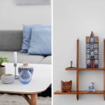 Living room with sofa, table, and decor. Wall shelf with figurines and vases.