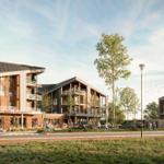 Moderne Wohnhäuser mit Balkonen und Geschäften im Erdgeschoss.