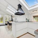 Kitchen with white countertop and skylight