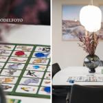 Spieltisch mit Tier-Spiel und Deko-Vase im Essbereich.